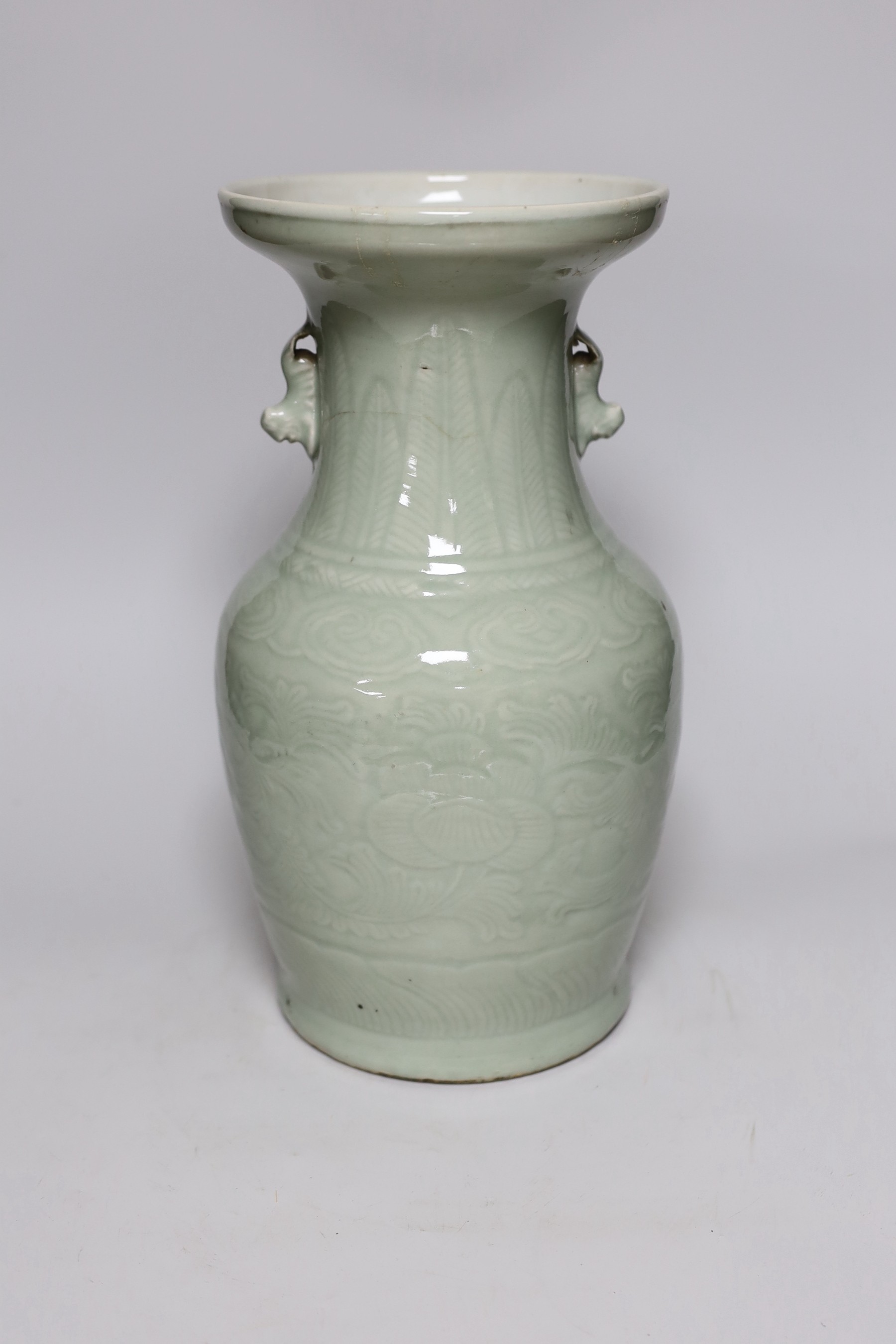 A Chinese celadon glazed vase, 19th century, 33cms high